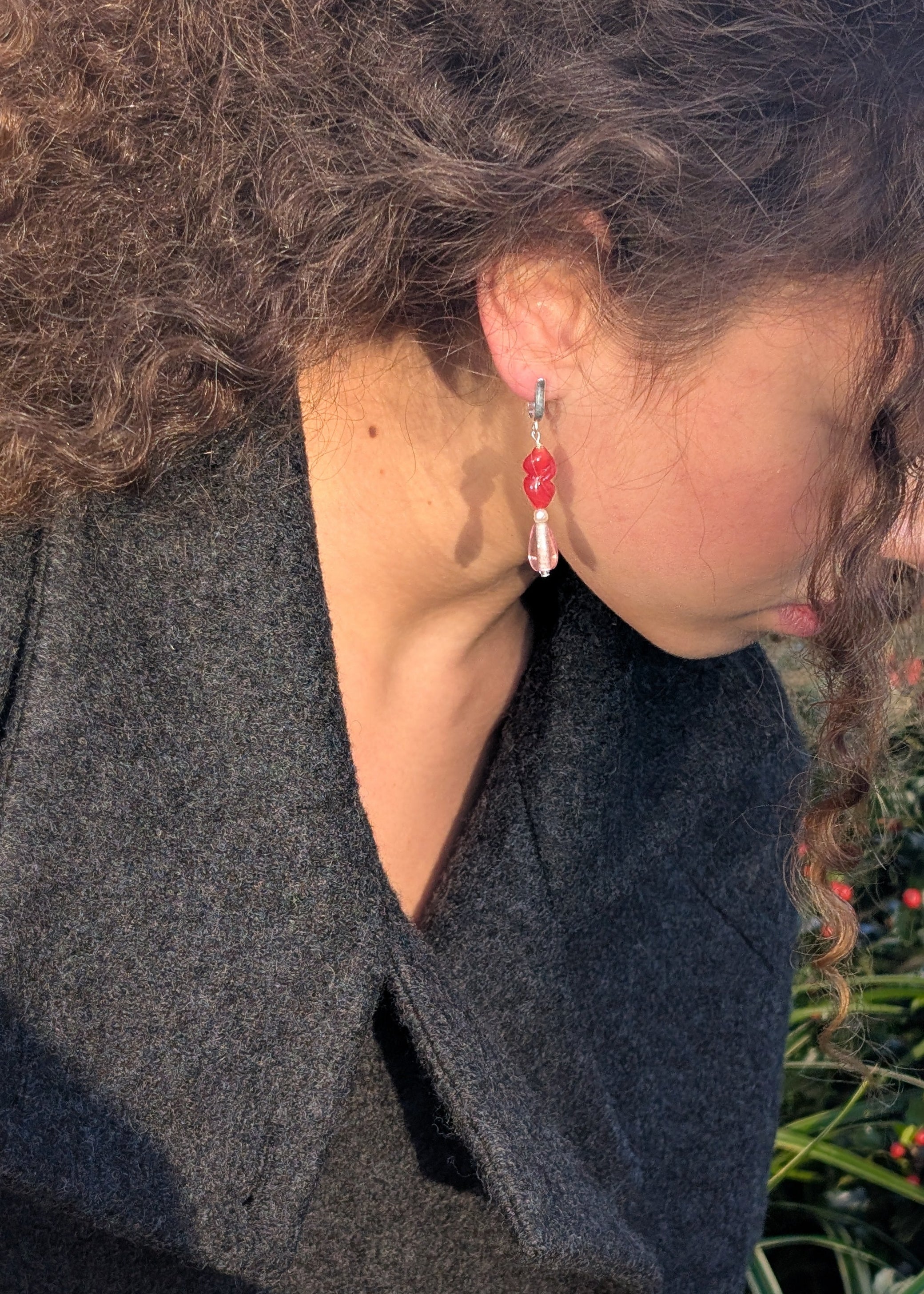 Person wearing a dark coat with a blurred background