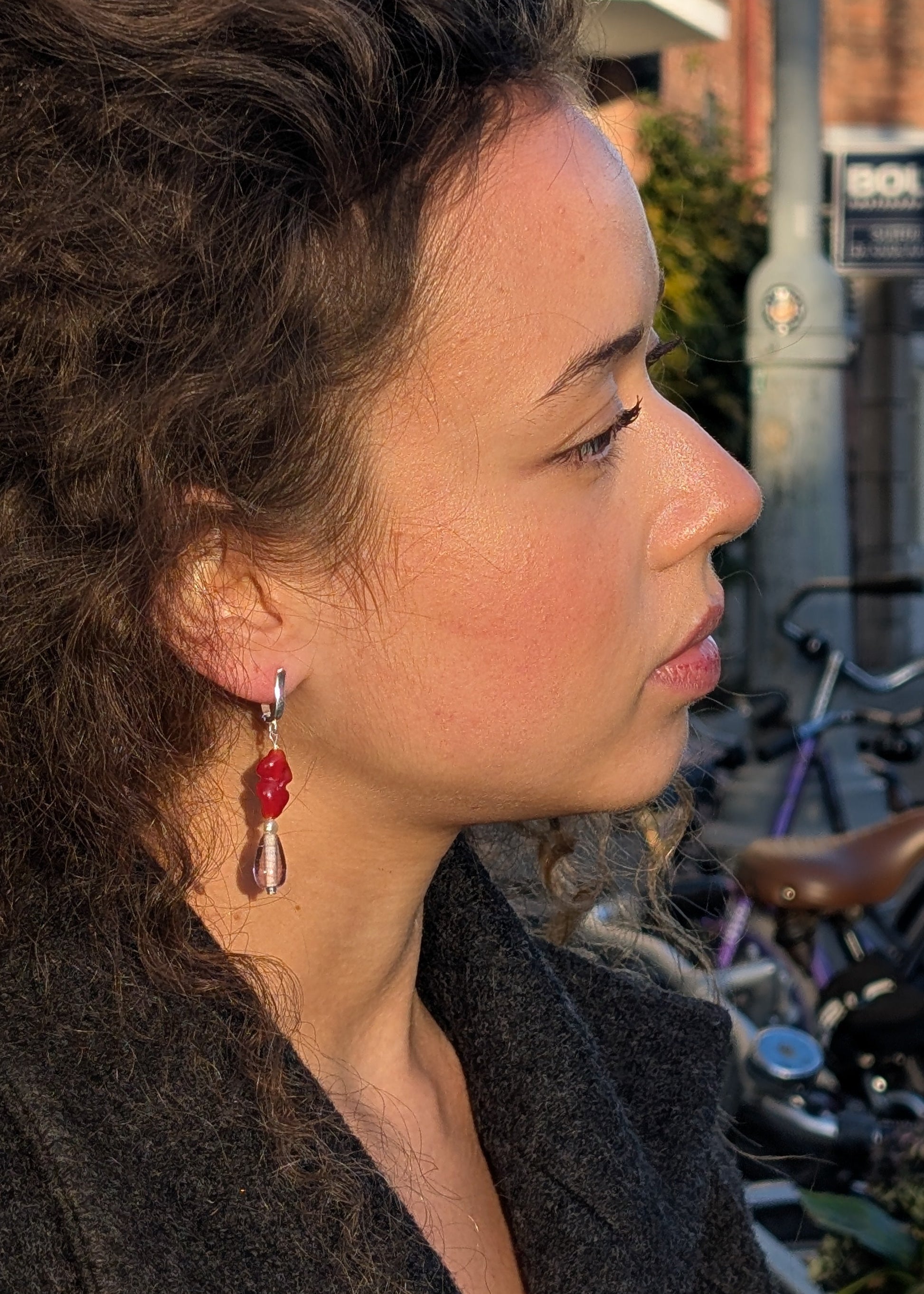 Woman wearing earrings with a blurred background