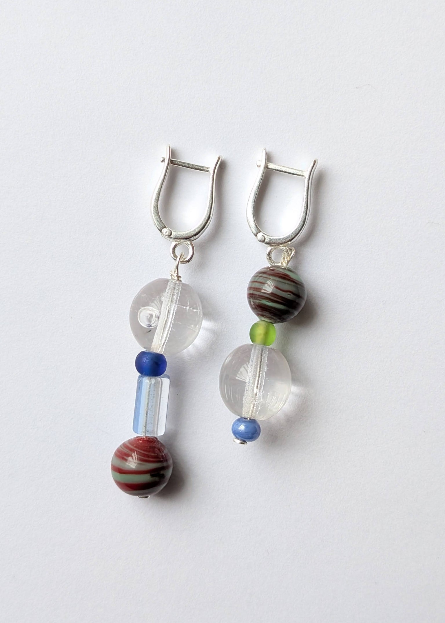 Pair of earrings with beads on a white background