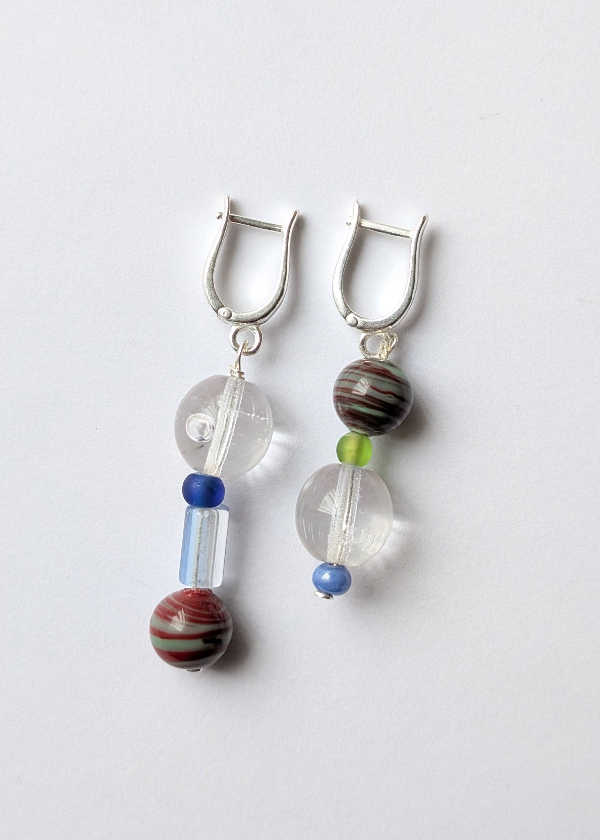 Pair of earrings with beads on a white background