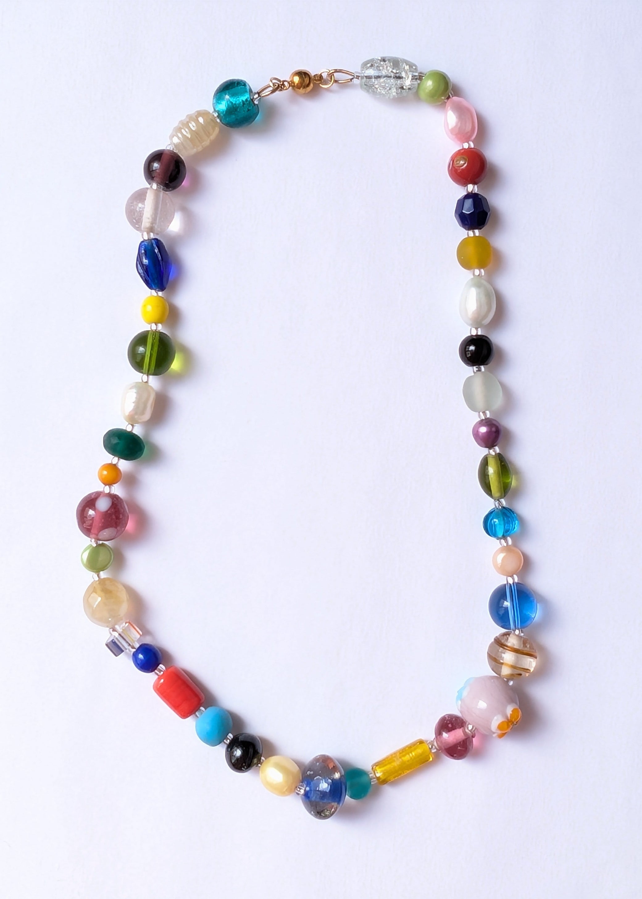 Colorful beaded necklace on a white background