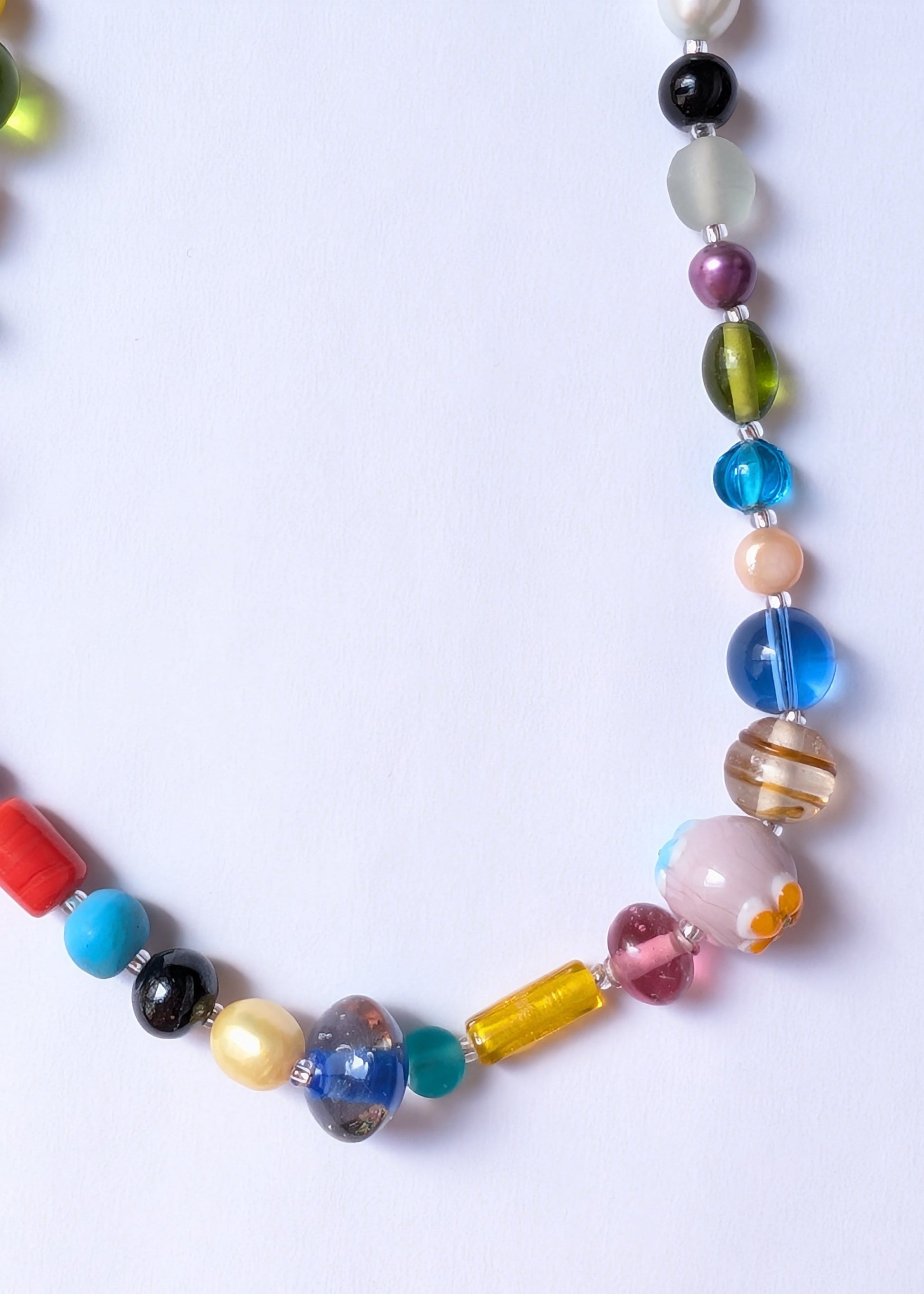 Colorful beaded necklace on a white background