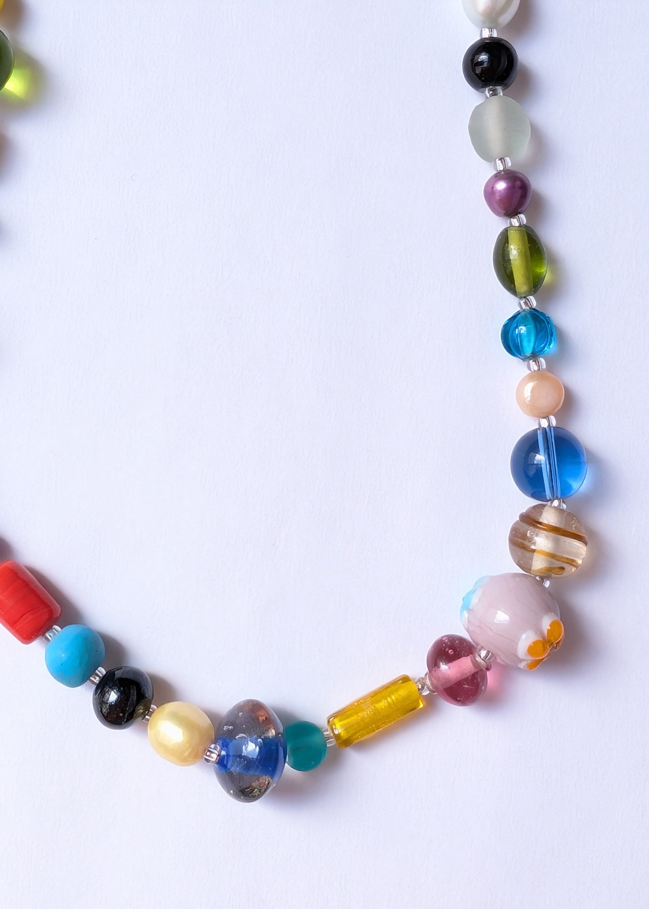 Colorful beaded necklace on a white background