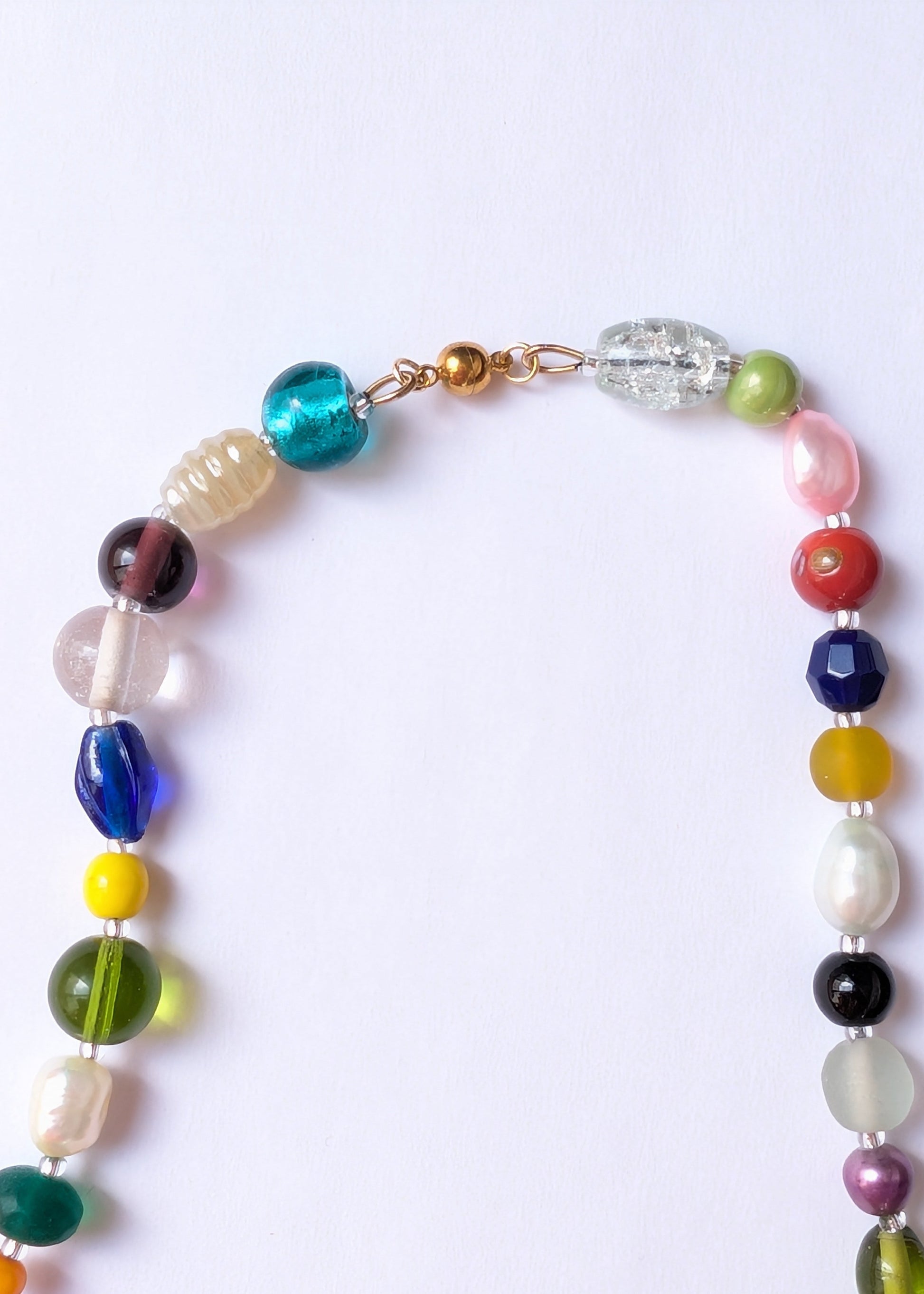 Colorful beaded necklace on a white background