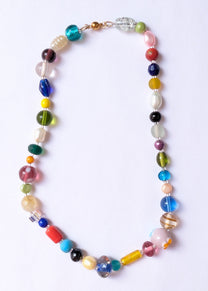 Colorful beaded necklace on a white background