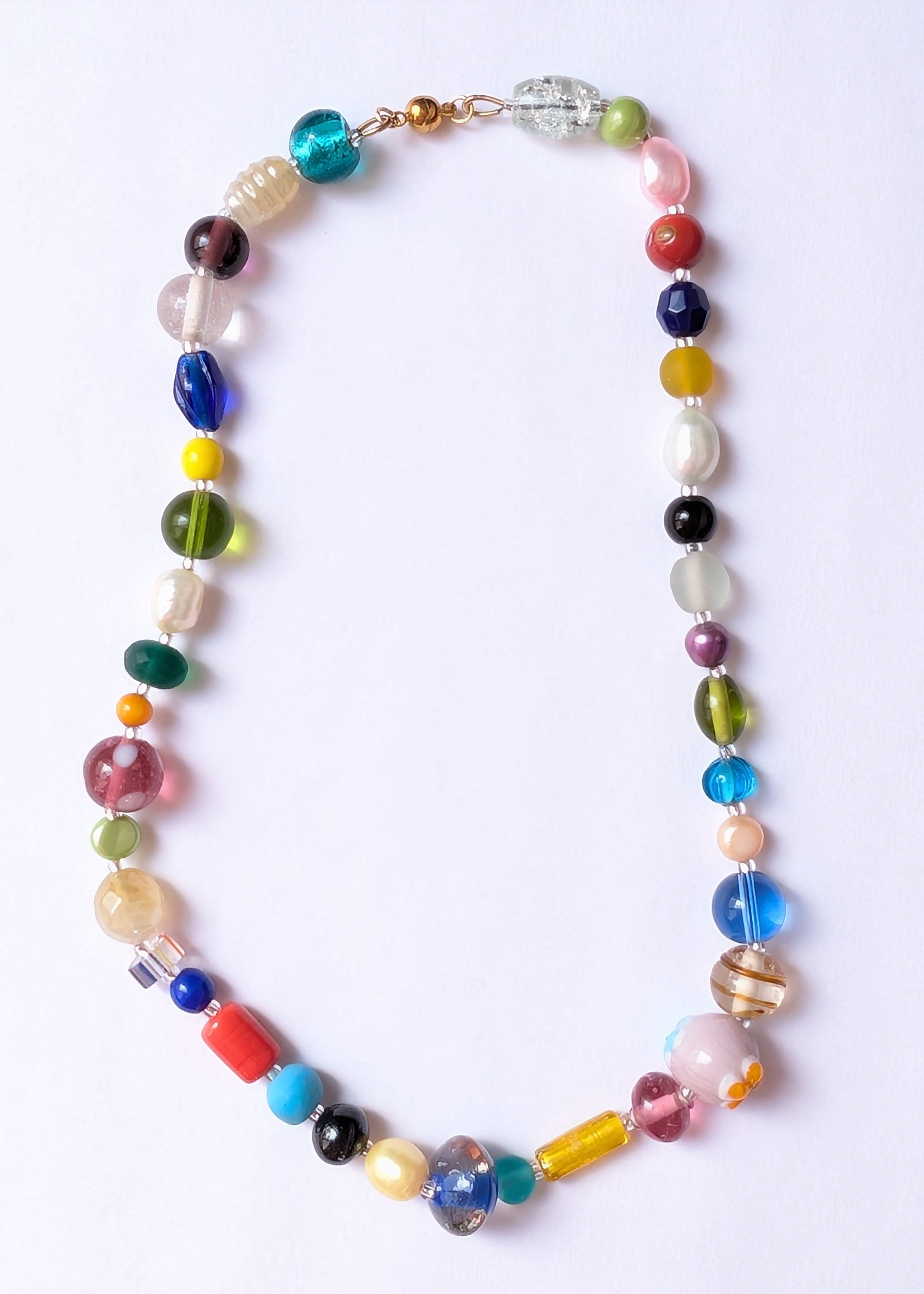 Colorful beaded necklace on a white background